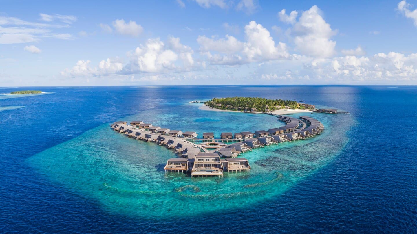 Aerial view of The St. Regis Maldives Vommuli Resort and its reef